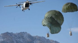 Xe/Blackwater CASA 212 over Afghanistan dropping supplies to U.S. Army troops. Are they involved in far more sinister activity? (Photo: supportdanielboyd.files.wordpress.com)